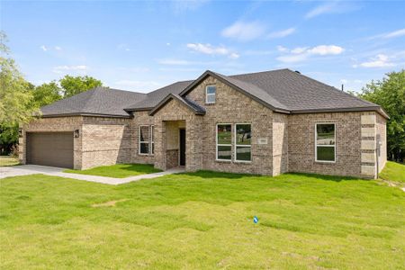 View of front of home with a garage and a front yard