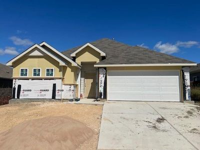 View of front of home with concrete driveway and stucco siding