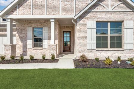 Property entrance featuring a lawn