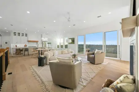 The main floor sits at the top of the home and provides priceless hill country vistas through oversized widows and dual opening sliders that open your living space onto a large entertainer’s deck.