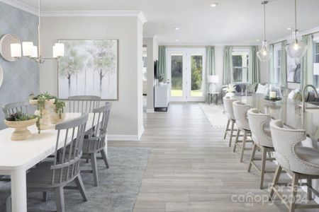 View down Hall with Breakfast room on Left and Kitchen on Right-Similar to Subject Property