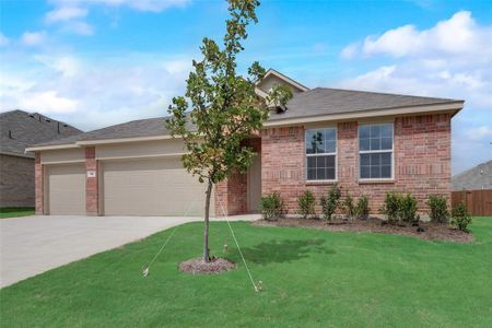 View of front facade with a garage and a front lawn