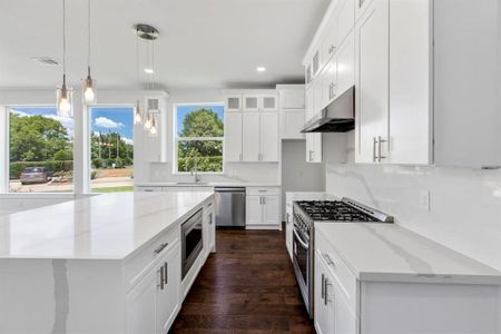 Kitchen open to the dining and family. room allowing for interaction with your family and friends.