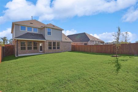 Rear view of house with a yard