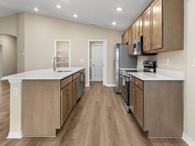 Your new kitchen includes quartz counters, 36-inch cabinets, Samsung SS appliances, and a walk-in pantry.