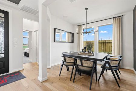 *REPRESENTATIVE PHOTO* Our formal dining area has been converted into a study, complete with elegant French doors. This modification adds versatility and charm, providing a dedicated space for work or quiet activities within the home.