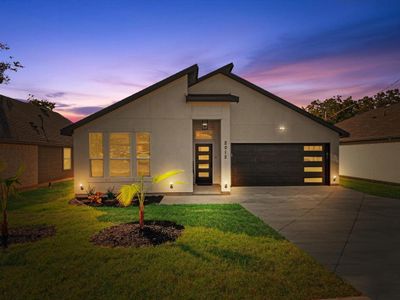 Contemporary house with a yard and a garage