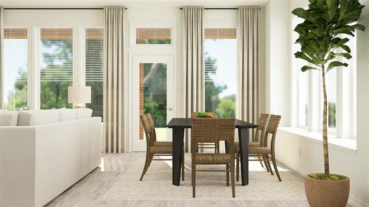 Dining area with light hardwood / wood-style flooring