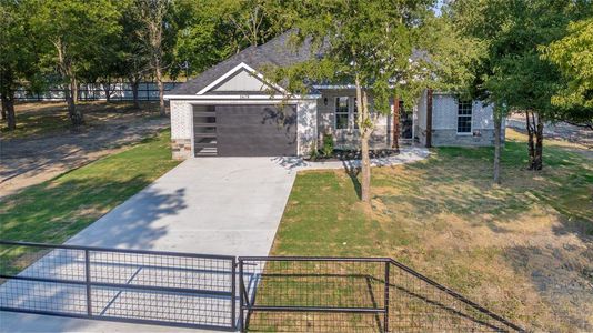 View of front facade featuring a garage