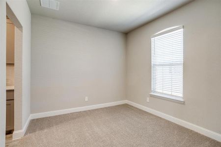 Flex space off entry featuring light carpet and plenty of natural light