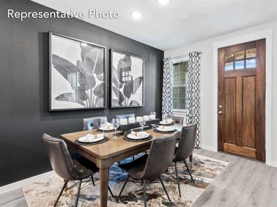 Dining area with light wood-type flooring