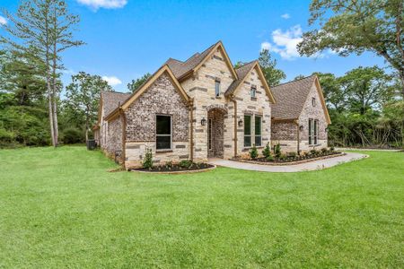 Stylish four-sided brick and stone elevation, custom home with exquisite finishes and features inside and out (virtually added sod)