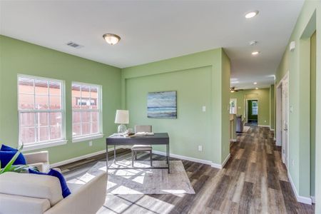 Office area featuring hardwood / wood-style flooring and ceiling fan