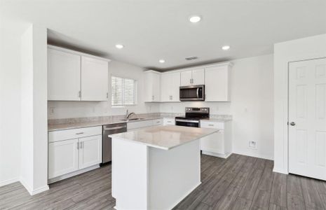 Airy kitchen with ample cabinet space*real home pictured