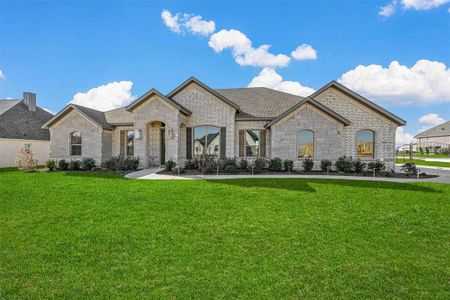 French country home with a front yard