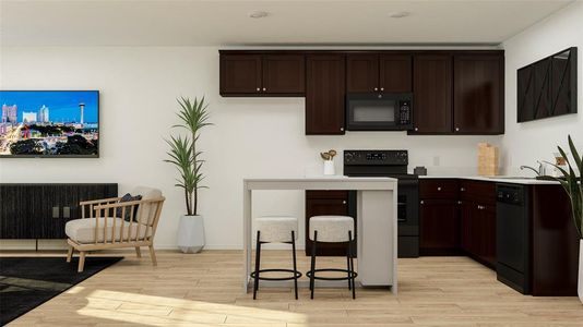 Kitchen featuring black appliances, light wood-type flooring, and dark brown cabinets