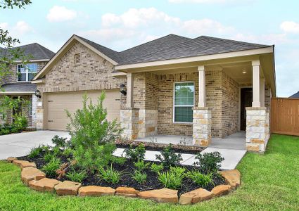 Beautiful brick and stone exterior with front yard landscaping