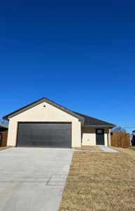 Ranch-style home, brick and stone front with a two car garage