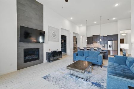 The main Living Area features 14 foot ceilings and a floor to ceiling Fireplace