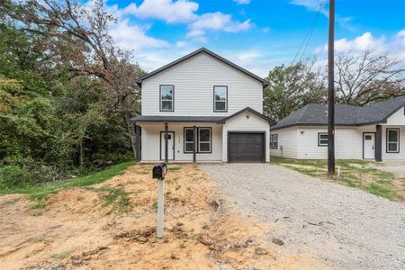 Front of property featuring a garage and covered porch