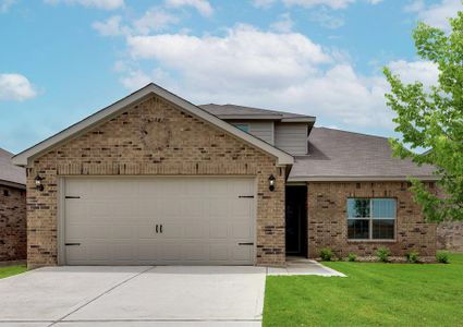 This stunning home has a beautiful brick exterior and an attached two-car garage.