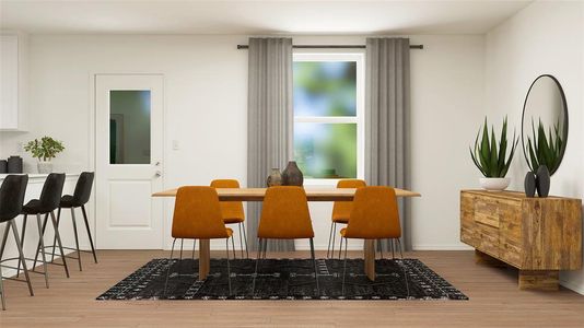 Dining space with wood-type flooring