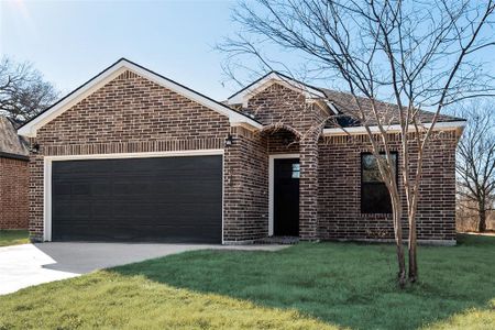 View of front facade with a garage and a front yard