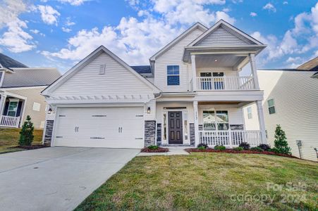 Homesite 63 features a Cypress H floorplan with front-load garage and balcony.