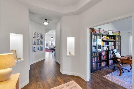 Hallway featuring dark hardwood / wood-style flooring