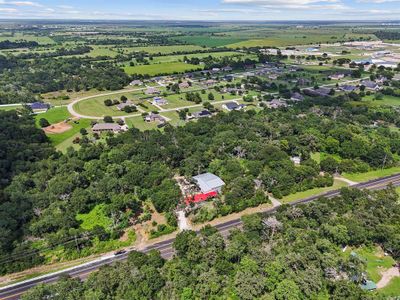 Amazing Commercial Workshop & Home on 1.75 acres! Outstanding location off of FM 359! Land can be utilized for Residential or Commercial purposes. Property does have gas and water! Mental Workshop was Previously Mental roofing business that spans an area of 80 feet by 58 feet, totaling 4,640 square feet under the metal roof!  Completely Remodeled Three Bedroom Home or could be outstanding Office!  Public Water and Gas!