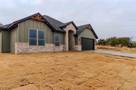 View of front of home featuring a garage