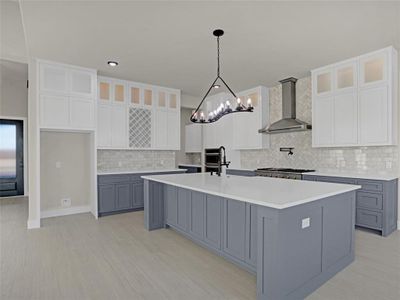 Kitchen featuring white cabinetry, gray cabinetry, a center island with sink, and wall chimney range hood