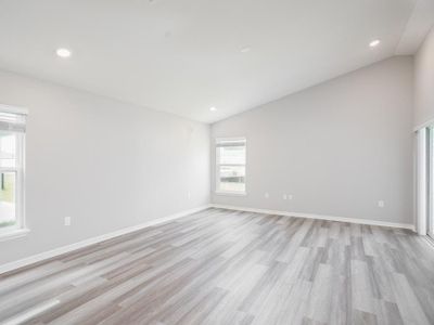 Enjoy a spacious open living area with luxury vinyl plank flooring. Photo showcases a home with similar finishes. Color and design options in actual home for sale may differ.