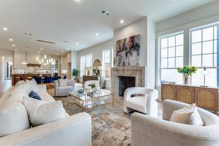 Living room featuring a premium fireplace