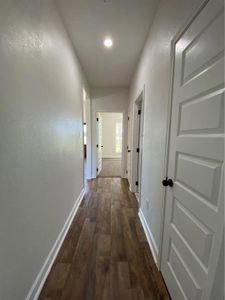 Hall featuring dark hardwood / wood-style flooring