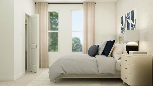 Bedroom featuring light colored carpet