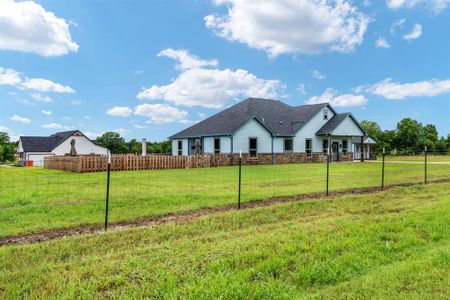 Corner Lot with perimeter fence and additional fence surrounding pool.