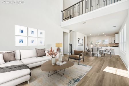 Virtually staged living room and dining room in the Medina floorplan at a Meritage Homes community.