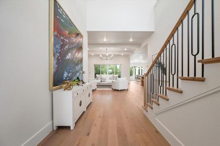 Foyer featuring light hardwood / wood-style floors and an inviting chandelier