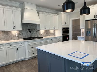 Awesome features such as shiplap range hood have been included in this home.