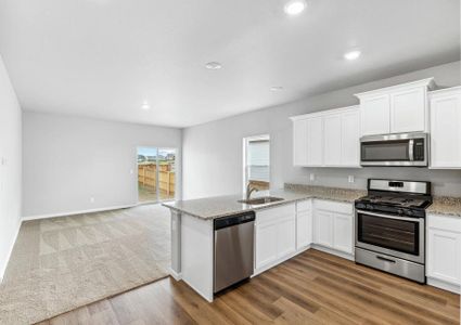 The kitchen of the Arapaho plan is located adjacent to the family room.