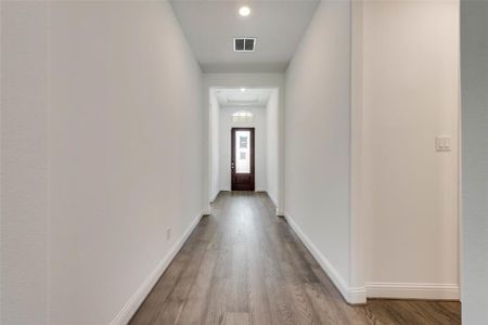 Hall with wood-type flooring