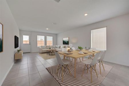 Dining area featuring light tile patterned floors