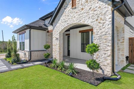 Property entrance with a lawn