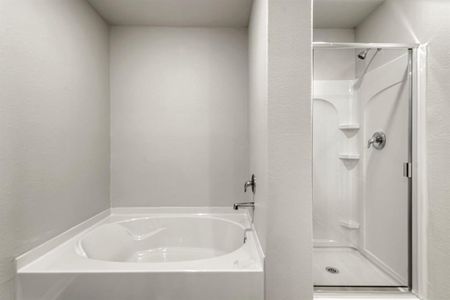 The en-suite master bathroom includes a soaking tub to provide you with an at home spa experience.