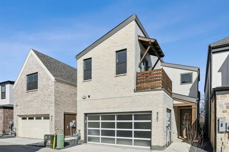 Contemporary house featuring front entry garage