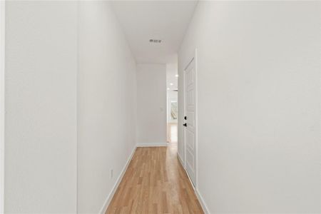 Hallway featuring light wood-type flooring