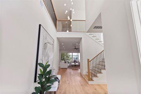 Entry way with double ceiling and one of a kind chandelier