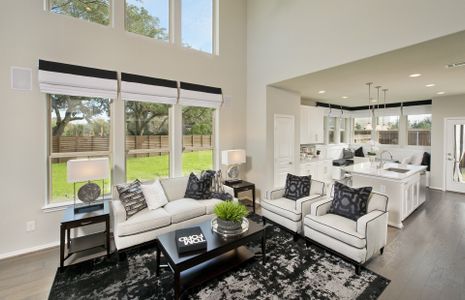 Gathering room with two-story ceilings and large w