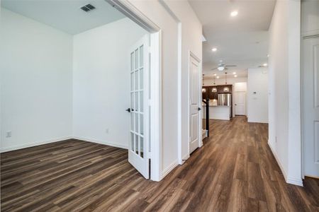 Hall with dark wood-type flooring